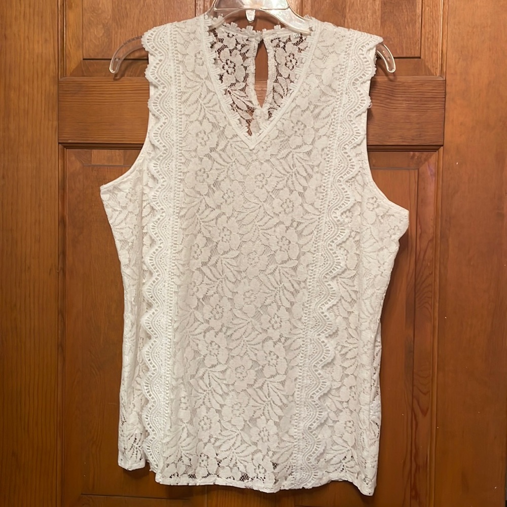 You don’t want to miss this one! Beautiful white lace sleeveless top.